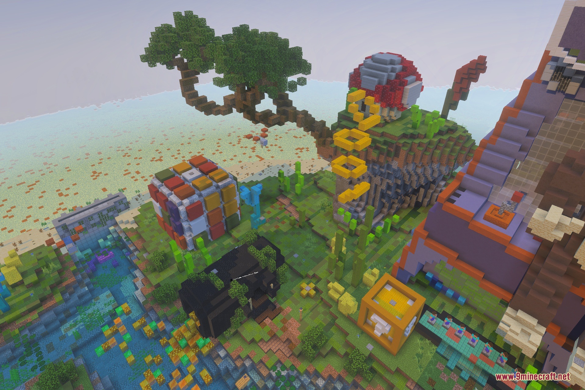 Giant Rubik cube and a tree with floating gold rings in a park