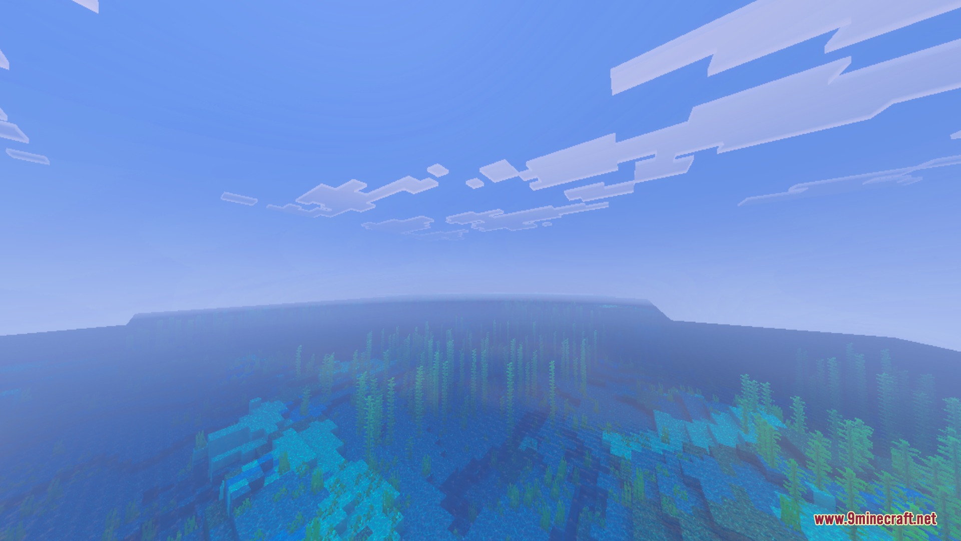 Clear Minecraft ocean water with kelp and atmospheric fog under blue skies