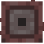 A dark, square, pixelated button item.