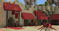 Desert village with red awnings and structures