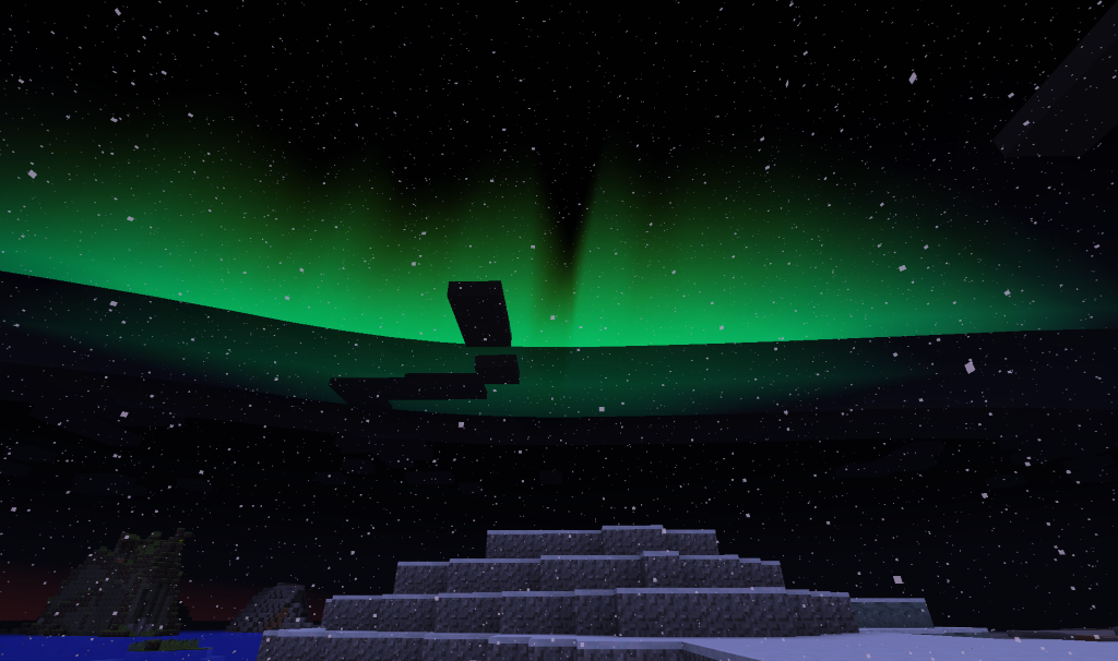 Aurora borealis over a snowy landscape at night