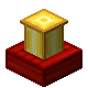 Golden block on red pedestal