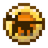 A golden, circular item with a brown center.