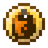 A golden, circular item with an orange center.