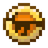 A golden, circular item with a brown center.