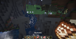 Large green dinosaur fossil in cave