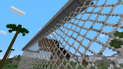 Dinosaur behind a chain-link fence