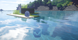 Two blue and white dinosaur eggs in water