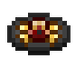 A small, dark, glowing red and gold item.