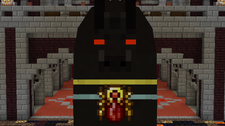 Black statue with red eyes and spider emblem