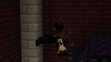 Player fighting a mob in a dark area