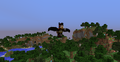 Player flying over a lush landscape