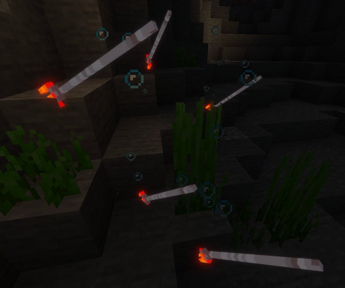 Glowing fish swimming in dark water