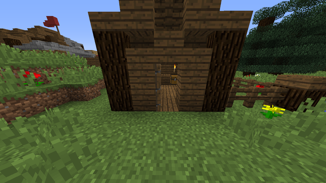 Small wooden house in a grassy field
