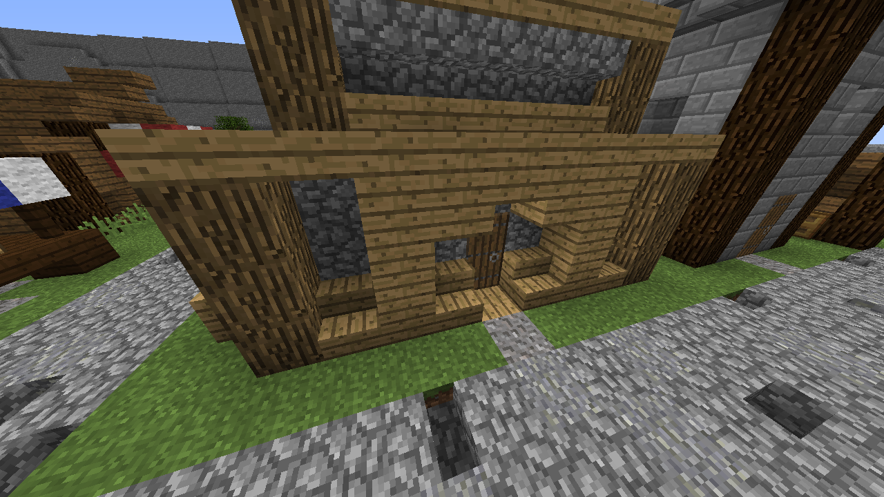 A small wooden building in a village.