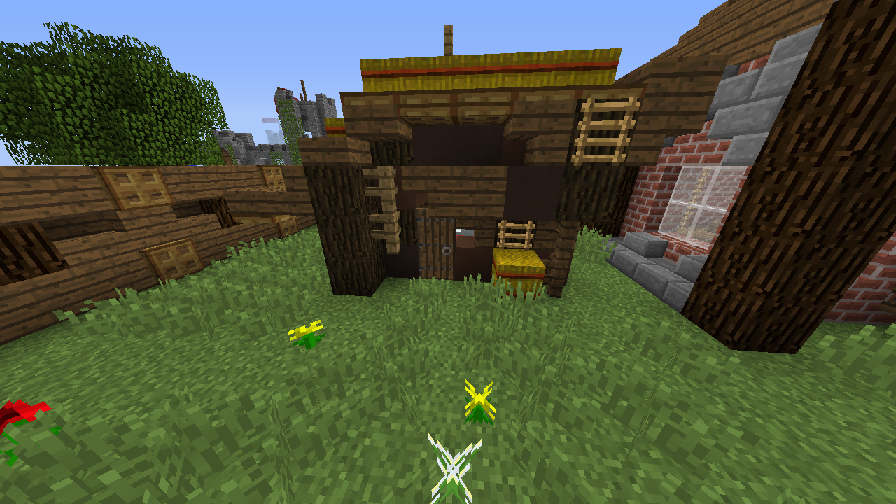 Small wooden house with ladder and hay bale