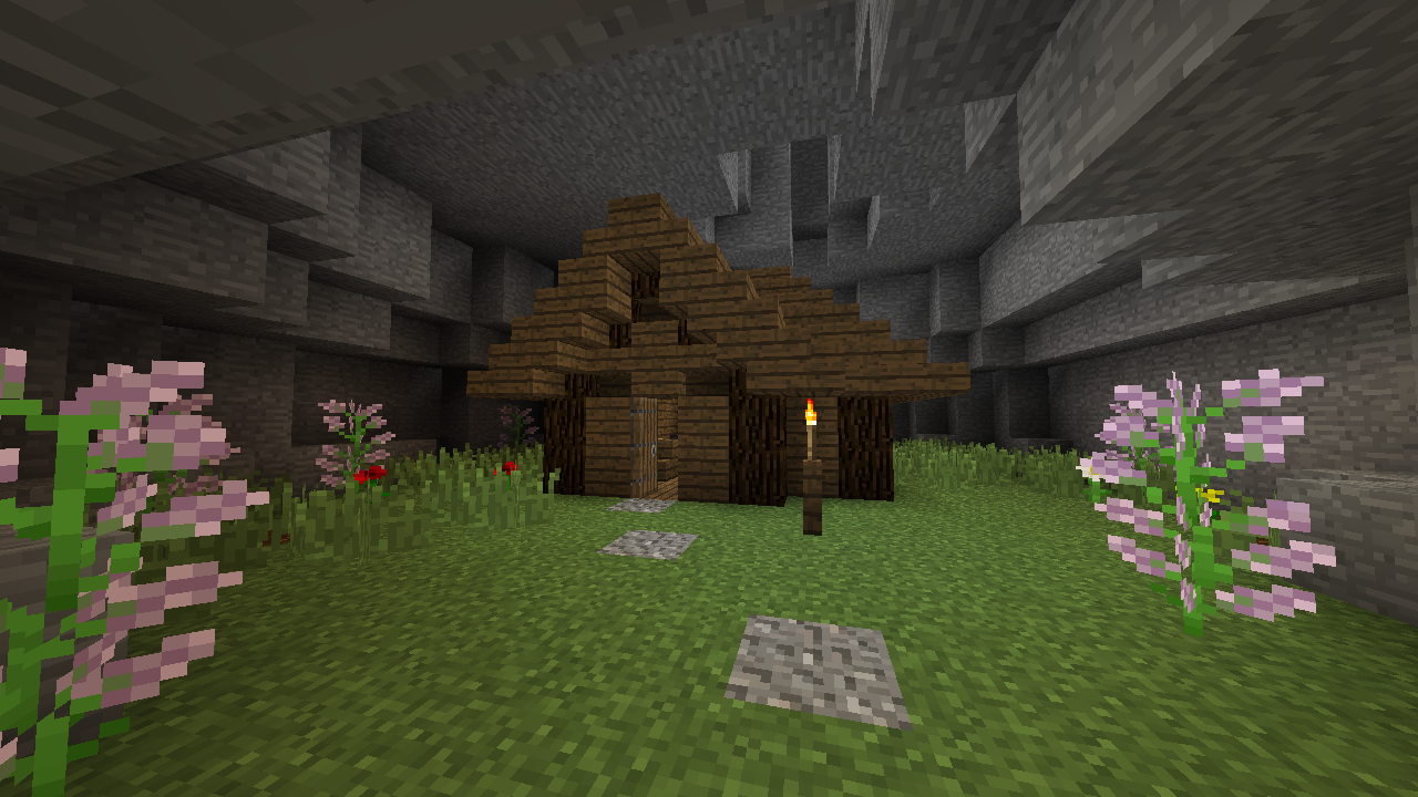 Small wooden house in a cave