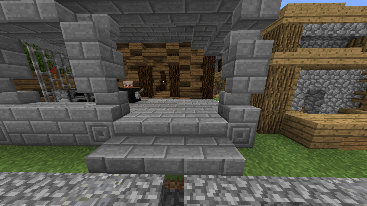 Stone brick porch leading to wooden house