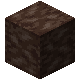 A dark brown dirt-like block.