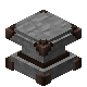 A gray stone and metal block.