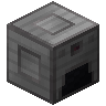 A gray furnace-like block with an opening.