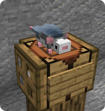 A small rat mob on a crafting table.