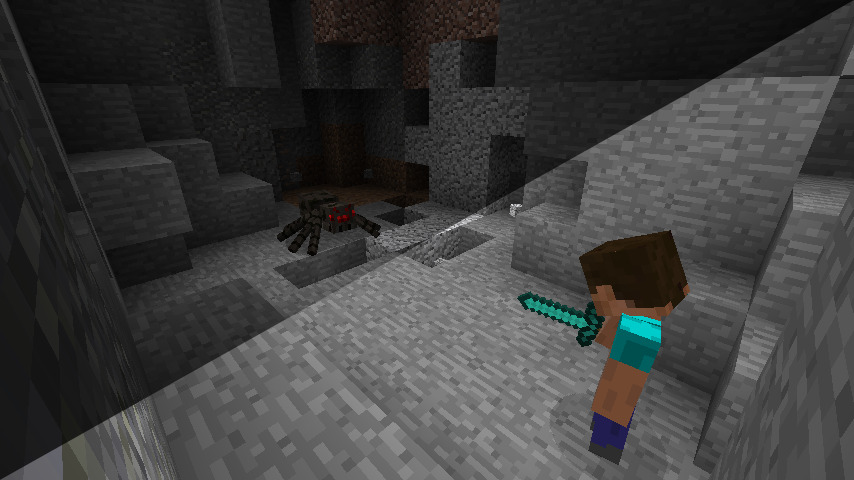 Player fighting a cave spider in a cave