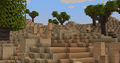 Desert landscape with sandstone blocks and trees