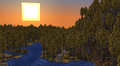 Sunset over a forest and river