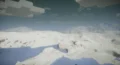 Snowy landscape with mountains in the distance