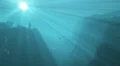 Sunlight streaming through deep blue water