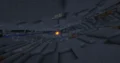 A dark, cavernous area with a glowing light.