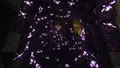 A dark figure with glowing purple particles.