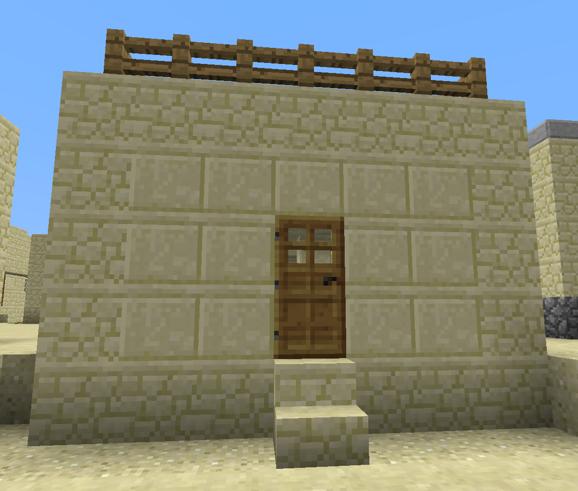Sandstone house with wooden door and railing